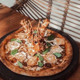 Pizzas y más en restaurante Vagalume Tulum